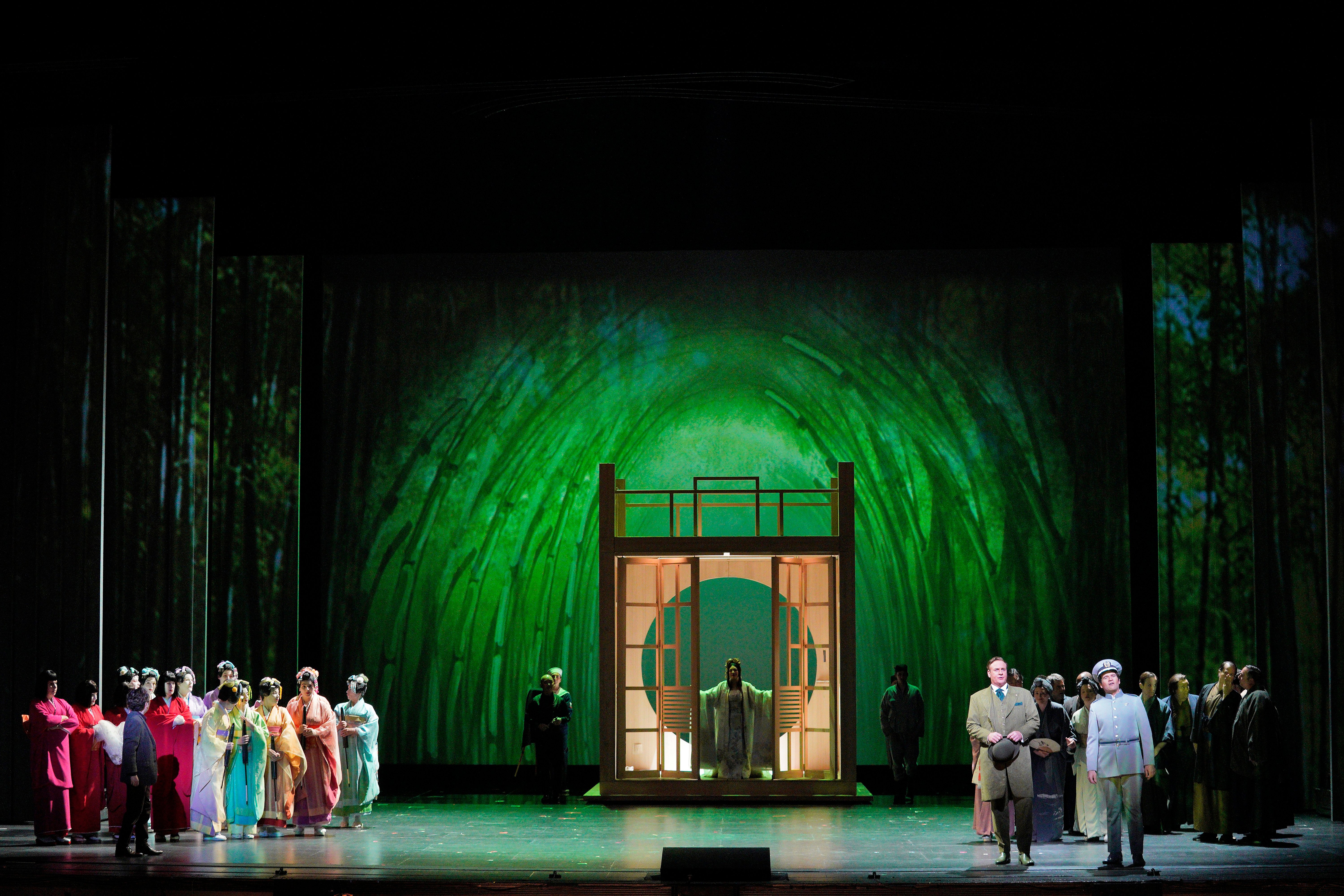 Madame Butterfly walking through doorway